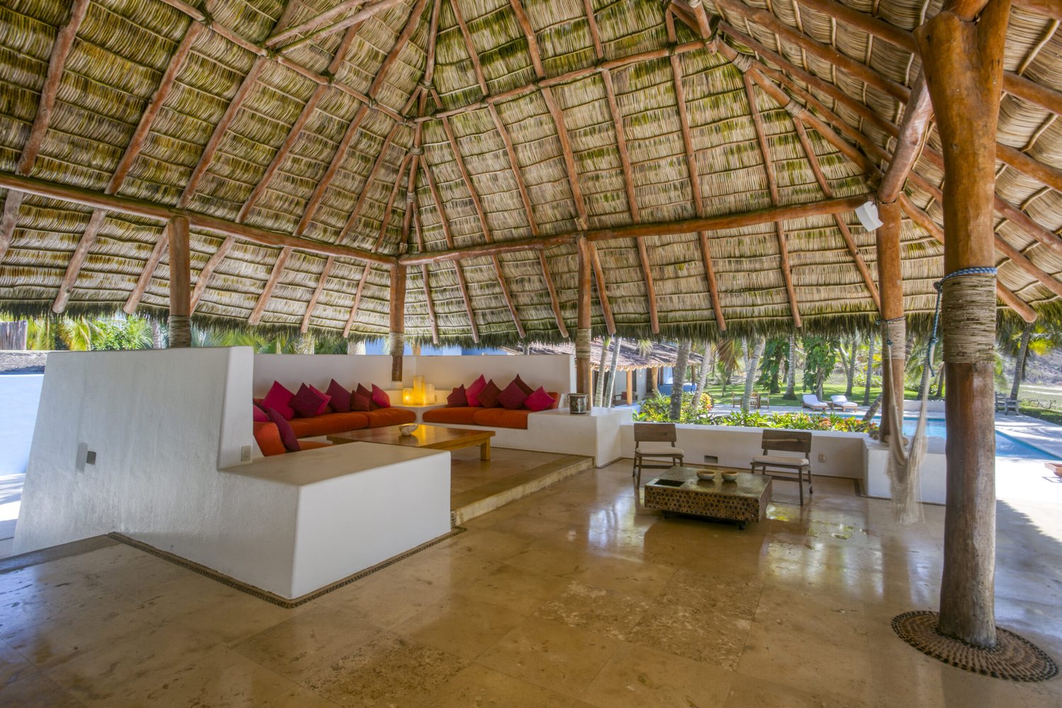 Outdoor living under the thatched palapa