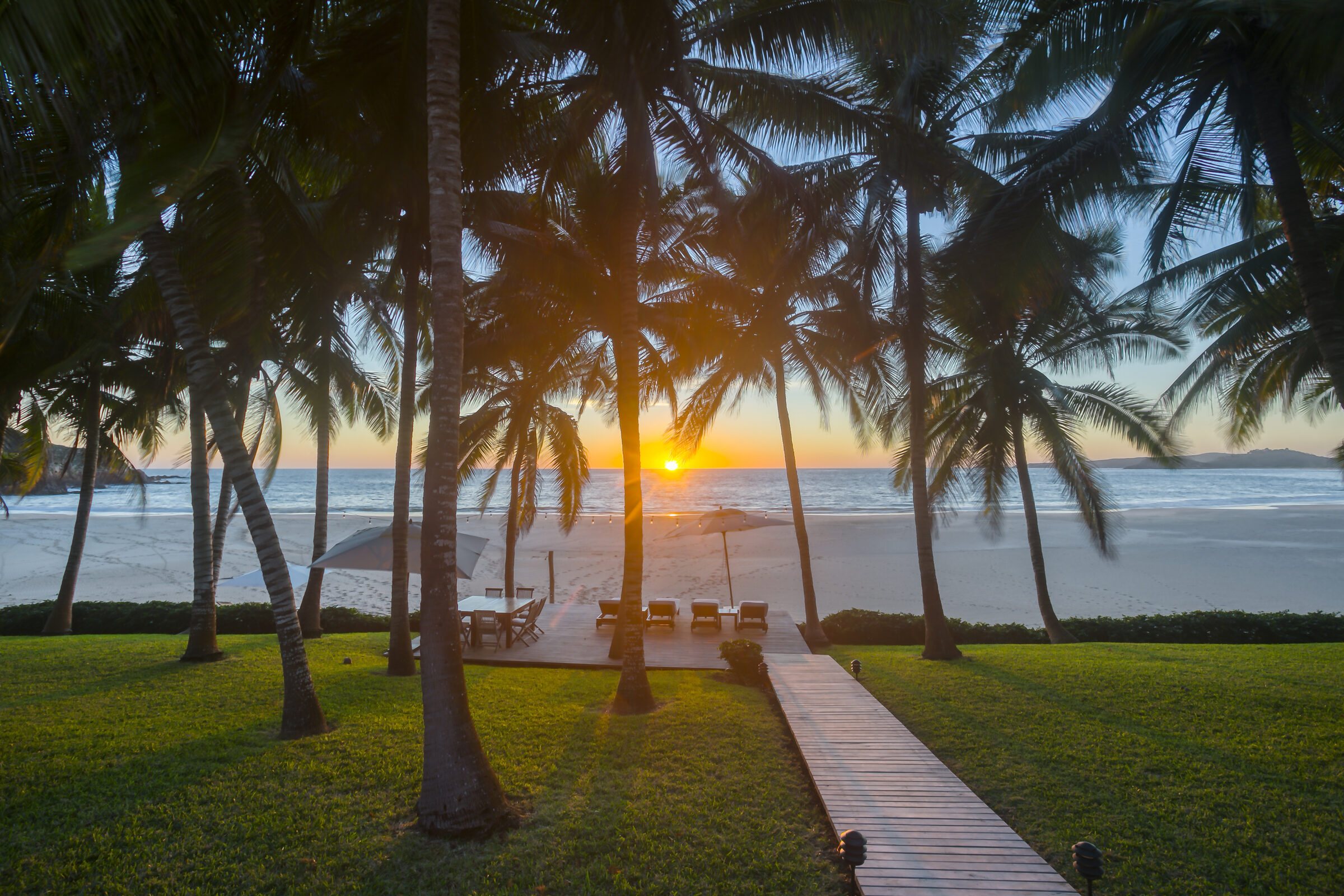 The deck at Playa Jaibas, looking over the pool to the beach and ocean